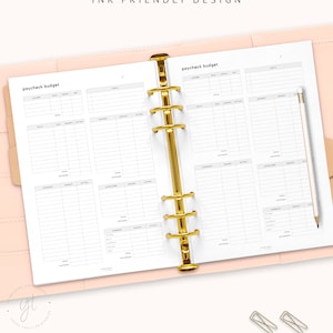 May include: A printable budget planner with two pages, each labelled "paycheck budget". The pages are designed for use in a ring binder and have columns for income, expenses, and savings.
