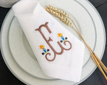 Geborduurde linnen herfstservetten: vogelverschrikkermonogram, Thanksgiving-diner