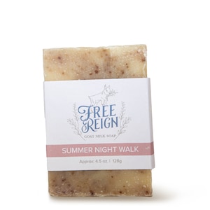 May include: A bar of goat milk soap with a white label that says "Free Reign Goat Milk Soap" and "Summer Night Walk" with the text "Approx. 4.5 oz. | 128g" below. The soap is a light brown color with flecks of brown throughout.