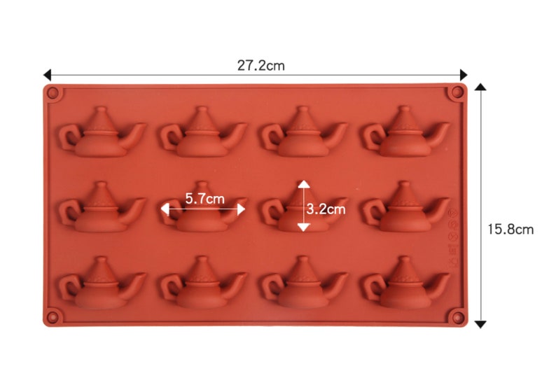 May include: A brown silicone mold with 12 teapot-shaped cavities. The mold measures 10.6 inches by 6.2 inches and each cavity is 2.2 inches wide and 1.3 inches tall.