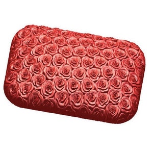 May include: A red clutch purse covered in a 3D rose pattern.