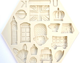 May include: A hexagonal silicone mold with 14 different designs, including a London bus, a phone booth, a cupcake, a rose, a crown, and a Union Jack flag. The mold is perfect for making fondant or chocolate decorations for cakes.