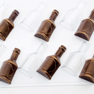 May include: A clear plastic mold with eight cavities shaped like liquor bottles. Each cavity is filled with a dark brown chocolate bottle with a gold label.