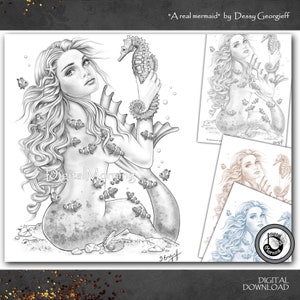 May include: Black and white digital art print of a mermaid holding a seahorse, surrounded by clownfish. The artwork is titled "A real mermaid" by Dessy Georgieff. Additional smaller prints are also visible.