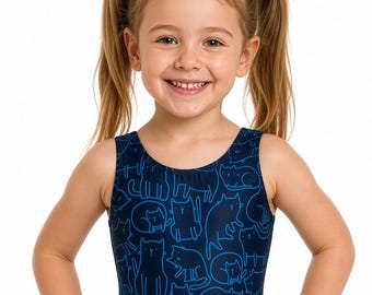 May include: A dark blue one-piece swimsuit featuring a repeating pattern of light blue line-drawn cats in various poses. The garment has a scoop neckline, wide shoulder straps, and a classic cut leg opening, providing full coverage for swimming.