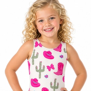May include: A white sleeveless leotard featuring a repeating pattern of pink cowboy boots, pink cowboy hats, green cacti, and small blue flowers. The garment has a round neckline and a fitted silhouette, showcasing a vibrant western-themed print.