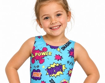 May include: A light blue sleeveless leotard featuring a vibrant comic book-inspired print with colorful speech bubbles and sound effect text including POW, WOW, ZOOM, SMASH, and POOF in shades of pink, yellow, purple, and black against the blue background.