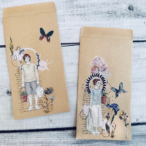May include: Two brown paper envelopes with decorative paper embellishments. Each envelope features a person wearing a face mask and holding a plant. One envelope has a butterfly and the other has a flower.
