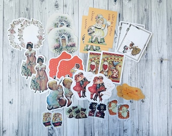 May include: A collection of vintage-style paper ephemera, including die-cut images of children, floral wreaths, and cards with text. The color palette includes soft pinks, yellows, and reds, with a distressed aesthetic. Ideal for scrapbooking and crafting.
