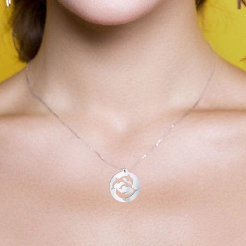 This dolphin necklace makes the perfect silver dolphin charm for sea and animal lovers.