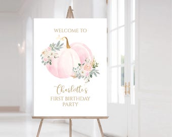 Puede incluir: Bienvenido al primer cumpleaños de Charlotte, cartel con una calabaza rosa y blanca con detalles florales.