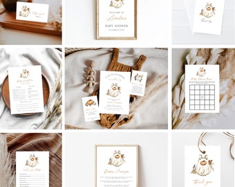 May include: A collection of baby shower stationery with a pumpkin theme. Includes invitations, thank you cards, a welcome sign, and games. The color palette is neutral with orange and brown accents. The text "Welcome to Amelia's Baby Shower" is visible.