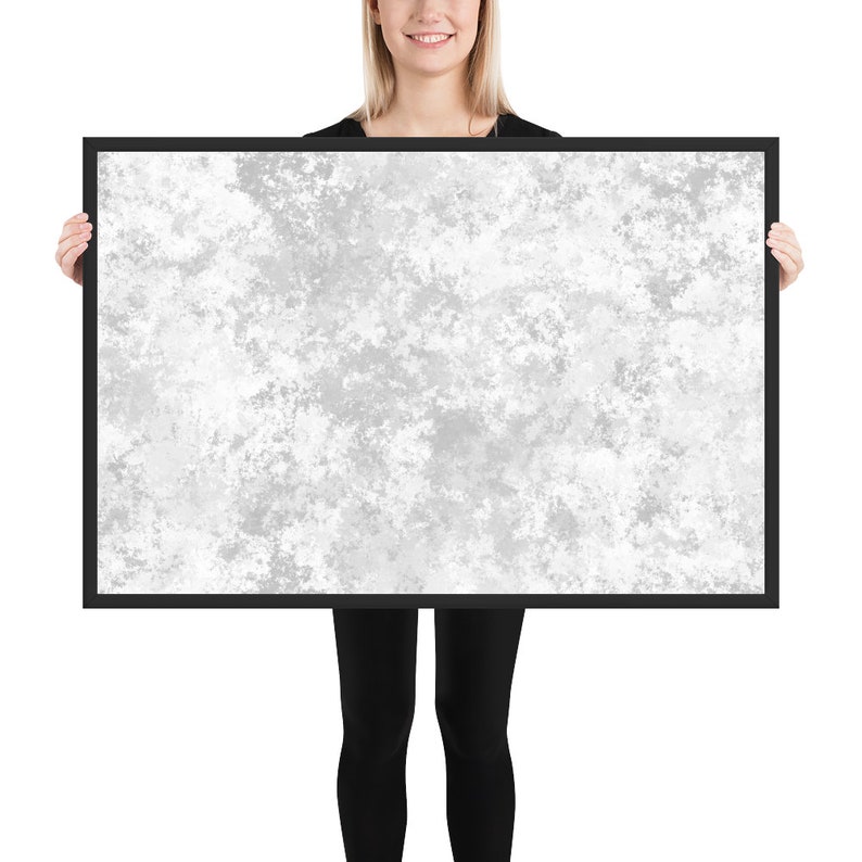 May include: A black framed canvas print with a white and gray abstract design. The design resembles a cloudy sky or a textured surface.