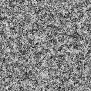 May include: A close-up of a grey, textured surface with a speckled pattern. The surface has a rough, uneven texture.