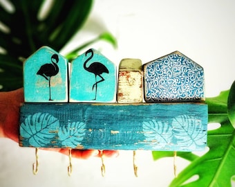 Key holder for a wall with small houses and birds image,