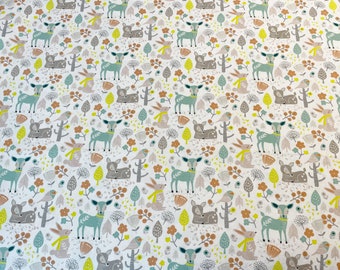 May include: White fabric with a repeating pattern of stylized deer, birds, and leaves in shades of green, brown, and yellow.