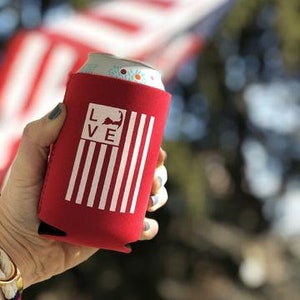 May include: Red and white can cooler with a red, white, and blue American flag design and the text "LOVE" with a stylized image of the state of Massachusetts.