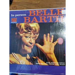 May include: A vintage vinyl record cover featuring a woman with blonde hair and a bright red dress. The cover is titled "Belle Barth" and includes the text "In person" and "For Adults Only Restricted From Air Play".