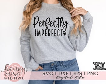 May include: A gray sweatshirt with the text "Perfectly Imperfect" in black lettering with a small heart symbol. The sweatshirt is being worn by a person with long blonde hair.