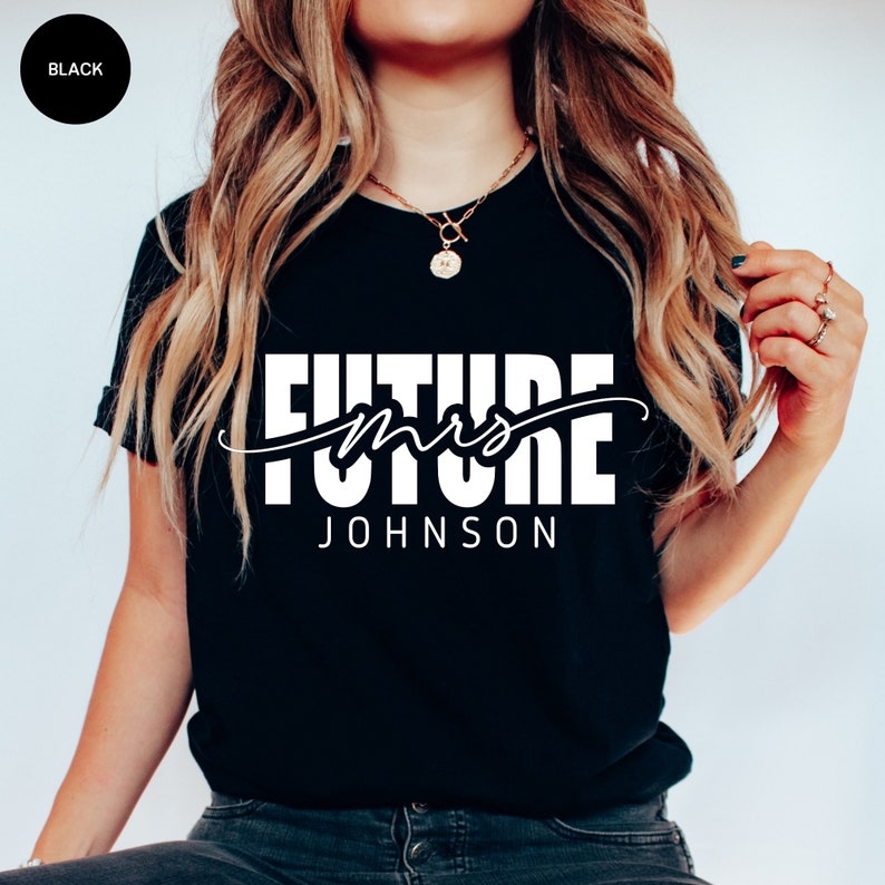 May include: Black t-shirt with white text that reads "Future Mrs. JOHNSON"