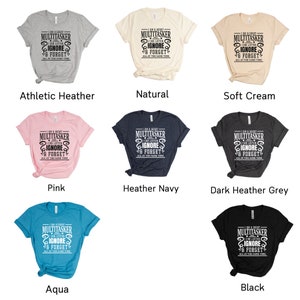May include: A set of ten t-shirts in various colors, each featuring the text "I am a great multitasker I can listen ignore & forget all at the same time".