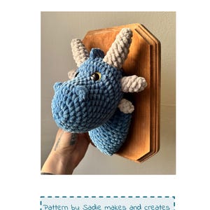 May include: A set of three ceramic mugs with a speckled, matte finish. Each mug features a different color: light blue, cream, and gray. The mugs have a simple, modern design and a comfortable handle.