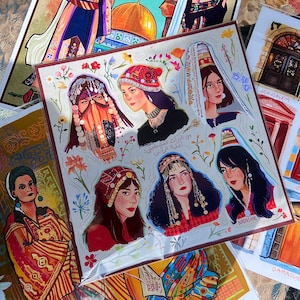 May include: A colorful illustration of women wearing traditional head coverings and clothing. The illustration is set against a background of flowers and greenery. The text in the image reads "من أين أتيت يا فلسطين:  ألف ليلة وليلة".