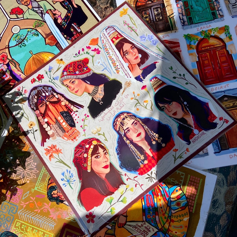 May include: A colorful illustration of women wearing traditional headwear and clothing from different cultures. The illustration is set against a background of floral patterns and text in Arabic.