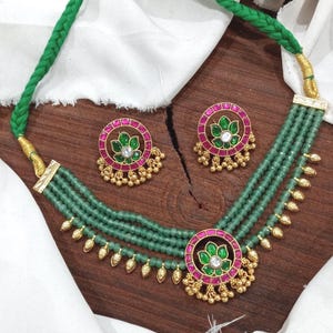 Traditional south temple jewellery choker set with floral pendant of kemp stones in red green. Facet multilayer Mala.Timeless combo.elegance