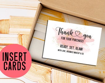 May include: A thank you card with a pink watercolour background and gold glitter. The card says "Thank you for your purchase! Ready, set, glam! With love, Organics Makeup & Co."
