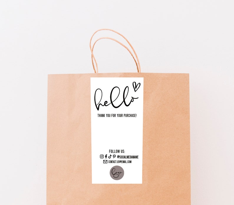 May include: A white thank you tag with black text that says "hello" with a heart symbol. The text below says "Thank you for your purchase!" and includes social media icons and contact information.