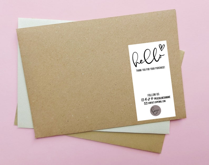May include: A white thank you tag with black text that says "hello" with a heart symbol. The text below says "Thank you for your purchase!" and includes social media icons and contact information.