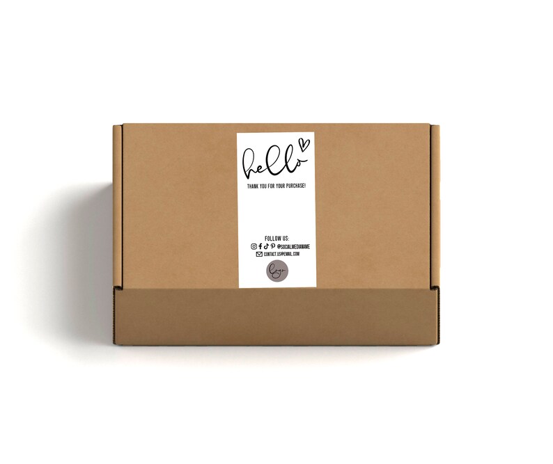 May include: A brown cardboard box with a white label that says "hello" with a heart symbol. The label also includes the text "Thank you for your purchase!" and social media handles for the business.