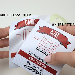 May include: Two rectangular paper tags with red and white graphics. One tag labeled WHITE GLOSSY PAPER features the name DAVID, while the other labeled WHITE MATTE PAPER features the name AJAY. Both tags display the text ICE ORIGINAL and WILL YOU BE MY GROOMSMAN?