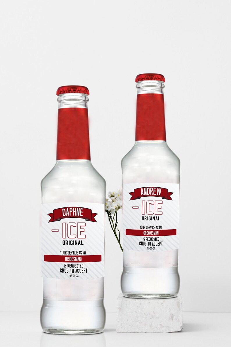 May include: Two clear glass bottles with red caps and red neck labels. The white rectangular labels feature the text "ICE ORIGINAL" and personalized requests for a bridesmaid and a groomsman, including the phrases "CHUG TO ACCEPT".
