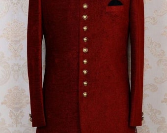 May include: A long, burgundy-coloured jacket with a mandarin collar and gold buttons. The jacket has a single pocket on the left side of the chest.