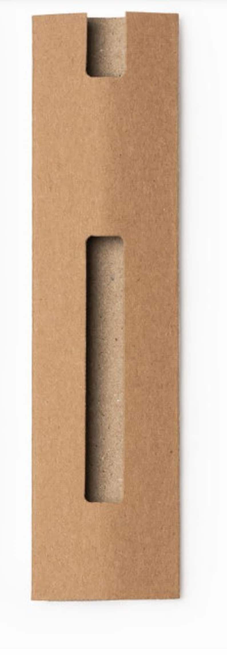 May include: A brown cardboard tube with a rectangular opening cut out of the side. The tube is designed to hold and protect a long, thin object.
