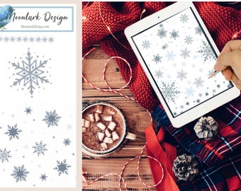 May include: A digital tablet with a white background and a design of snowflakes in shades of blue and gray. The tablet is on a wooden table with a red knitted blanket, a cup of hot chocolate with marshmallows, and pine cones.