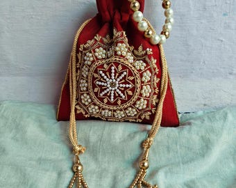 Handcrafted Pink Embroidered Potli Bag With Golden Zari