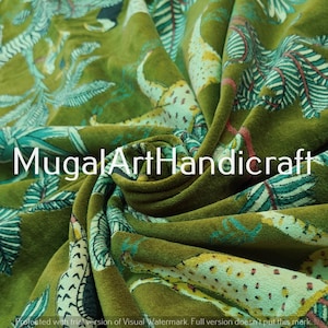 May include: Green velvet fabric with a printed design of leaves and animal silhouettes. The fabric has a soft, plush texture.