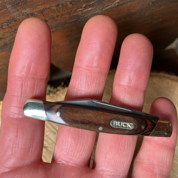Buck Solo small easy opening occasional use pocket knife in wood grain & silver