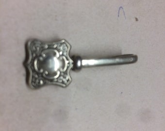 Bib Clip for posh dining-Edwardian era with decorated shield on the clip.