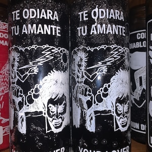 May include: Two black glass candle jars with white text and illustrations. The text on the jars reads "Te odiara tu amante" and "Your lover will hate you".