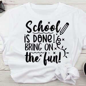 May include: White t-shirt with black text that reads "School is done! Bring on the fun!" with a pencil and sun graphic.