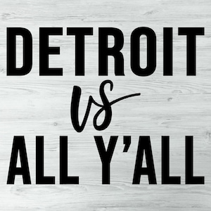 May include: Black and white text on a woodgrain background that reads "Detroit vs All Y'all".
