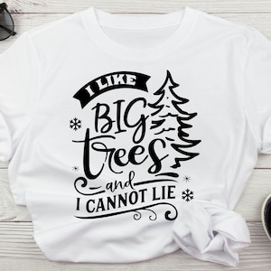 May include: White t-shirt with black text that reads "I like big trees and I cannot lie". The text is in a stylized font and includes a small pine tree graphic.