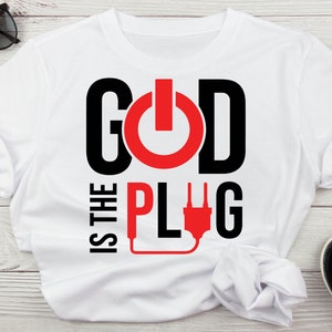 May include: White t-shirt with black text that reads "God is the Plug" with a red power button and a red electrical cord.
