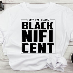 May include: White t-shirt with black text that reads "Today I'm Feeling Black Nif-i-Cent".