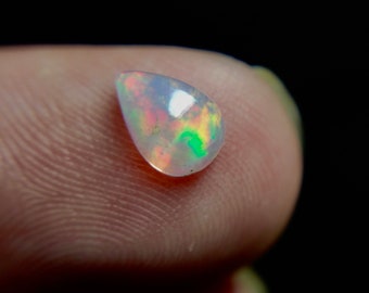 50/% discount on 0.60 ct Ethiopian welo opal.. Fire opal CABOCHON... 8x6 mm