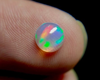 50/% discount on 0.60 ct Ethiopian welo opal.. Fire opal CABOCHON... 8x6 mm